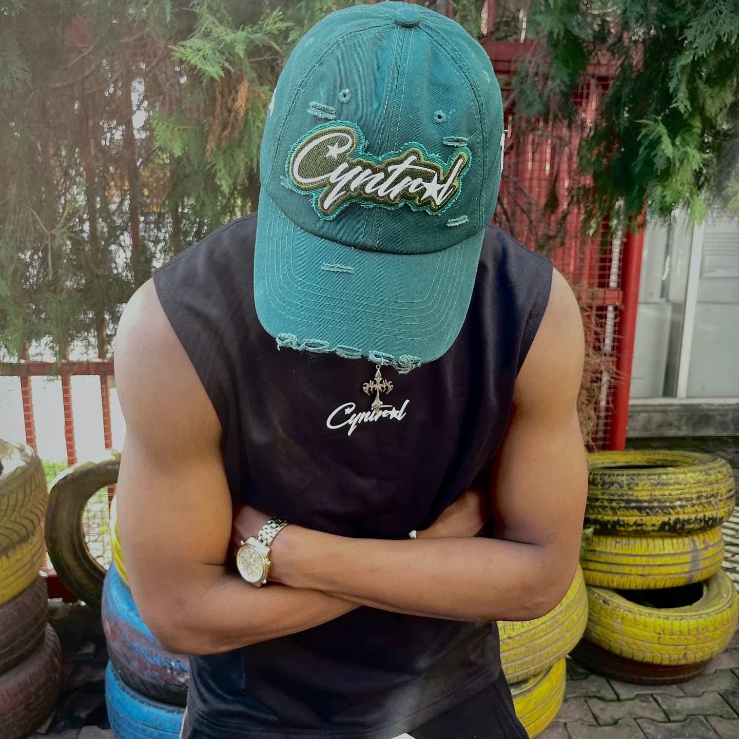 Portrait wearing a teal Cyntral cap